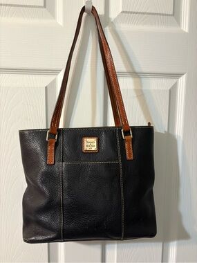 Dooney & Bourke Black “Lexington” Pebbled Leather Shoulder Bag w/Brown Handles